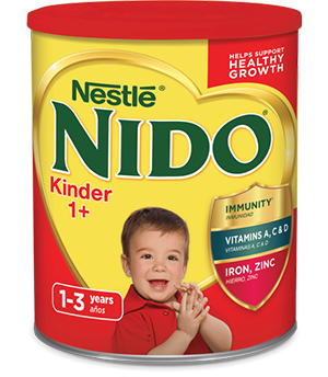 A canister of Nido 1+ with a shield that reads “immunity, Vitamins A, C, & D, Iron, and Zinc” near a young boy clapping.
