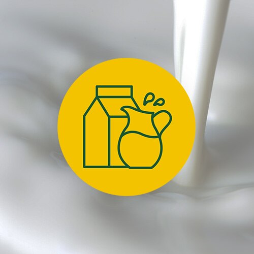 A yellow circle with an illustration of a milk carton and pitcher on an image of milk pouring.