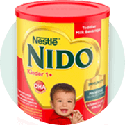 Container of Nido +1 with a red lid.