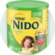 Yellow container of Nido 3+ powder with a green lid.