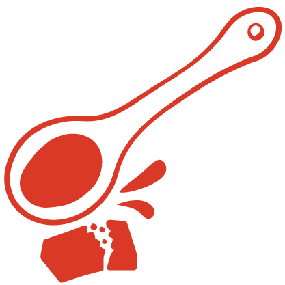 Image of a red spoon crushing a bouillon cube