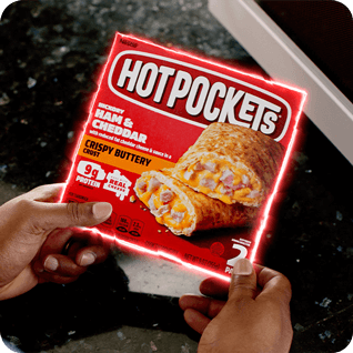 Ham & Cheddar Hot Pockets® packaging with a neon outline being held by hands.