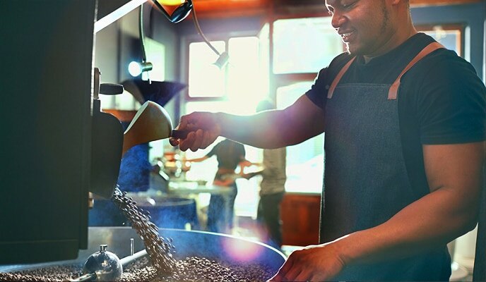 man using a coffee machine