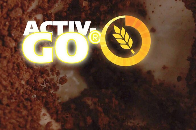 The Activ Go malt symbol over MILO powder dissolving into milk.