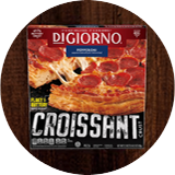 A package of DiGiorno Croissant Crust Pepperoni pizza featuring a pepperoni pizza with a slice being pulled away, a blue label