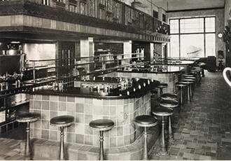 A black and white photo of the lunch counter at the first Stouffer's restaurant.