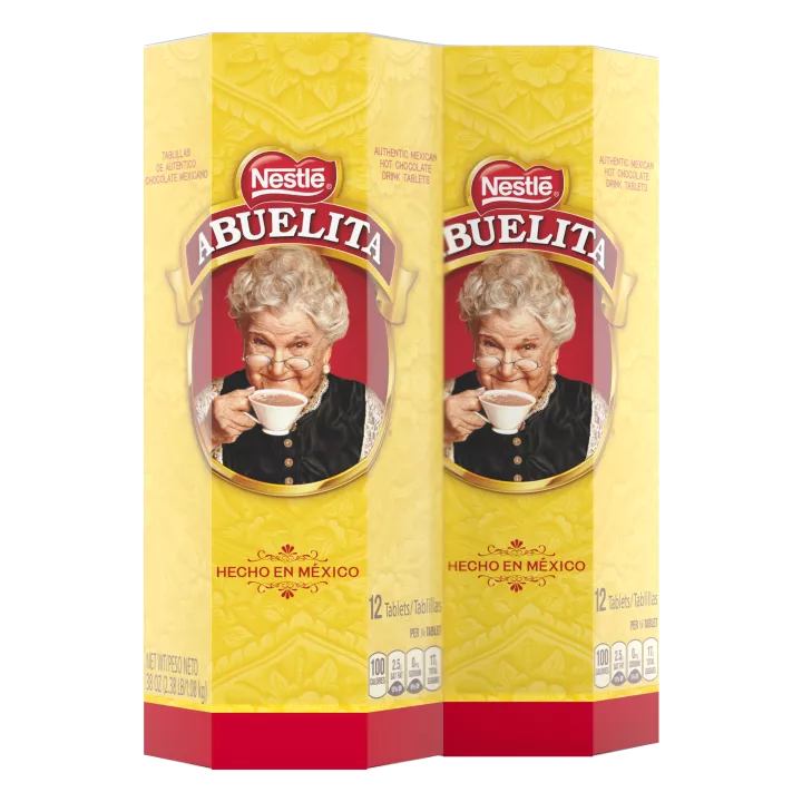 A yellow hexagonal box with the Abuelita logo, red designs and the words "HECHO EN MÉXICO."