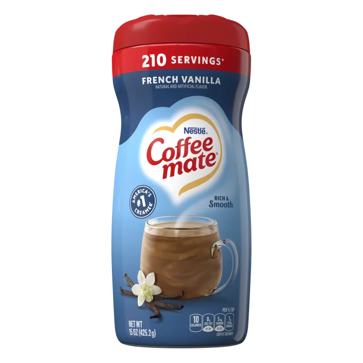 A blue canister of Coffee mate French Vanilla Powder with a red cap above a mug of coffee and vanilla beans.