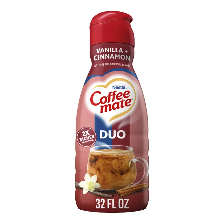A red bottle of Cinnamon Vanilla Crème creamer with a coffee mug and cinnamon sticks under the Coffee mate logo.