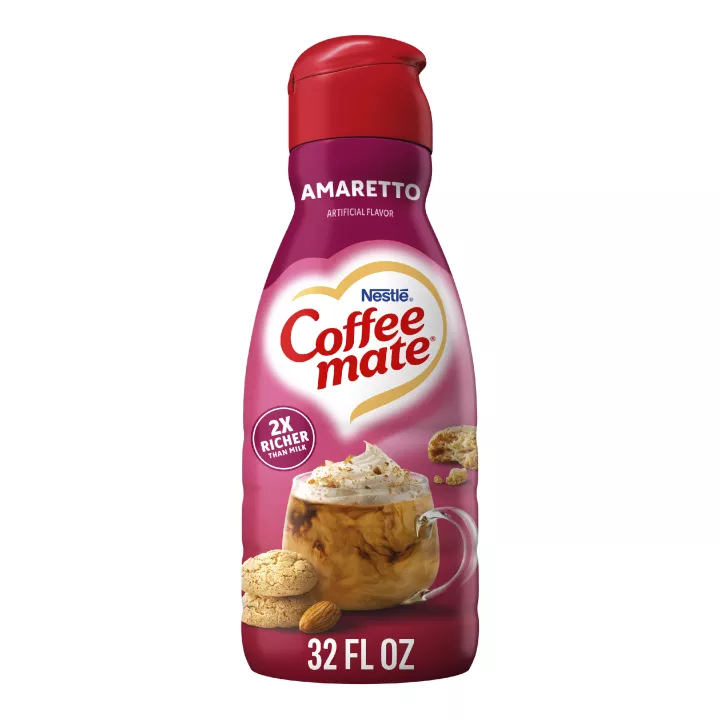 Una botella rosada de creamer Amaretto con amaretto y almendras debajo del logotipo de Coffee mate.