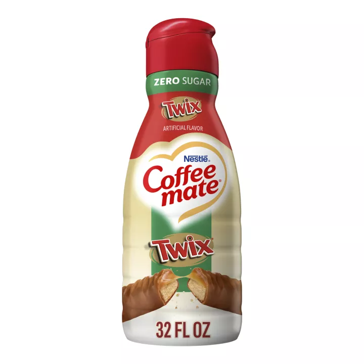 A bronze bottle of Twix® flavored coffee creamer with the green Zero Sugar label above the Twix logo and a candy bar.