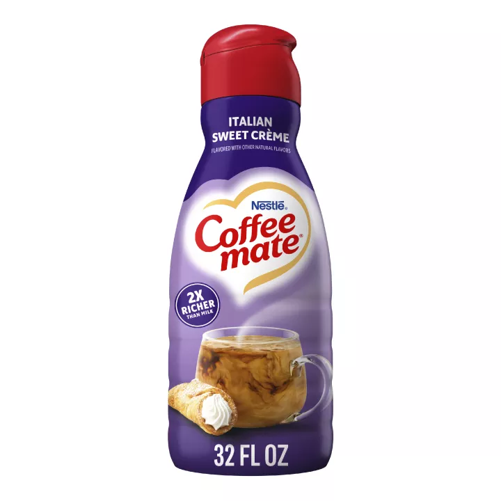 A purple bottle of Italian Sweet Cream Creamer with a purple label above a mug of coffee, cannoli and the Coffee mate logo.