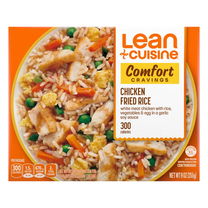 A box of Chicken Fried Rice with a Comfort Cravings label near a bowl of rice with chicken, carrots, peas, and scrambled eggs.