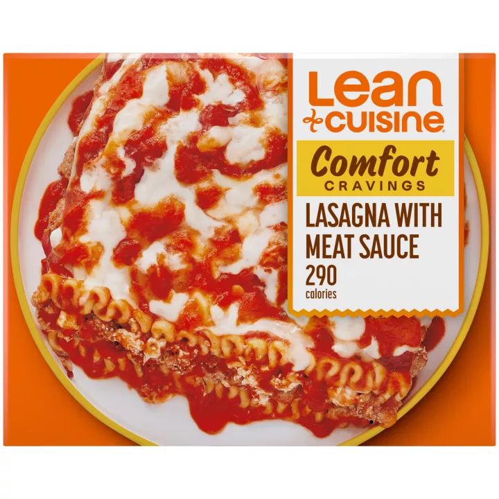 A box of Lasagna with Meat Sauce with a Comfort Cravings label near a bowl of lasagna with seasoned meat, tomato and mozzarella.