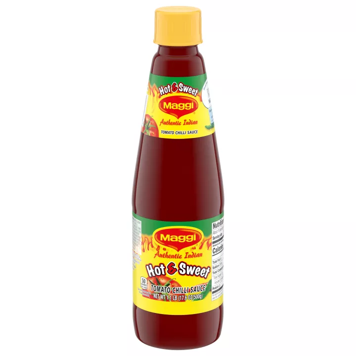 Bottle of Hot and Sweet Tomato Chili Sauce with a bright yellow and green label with tomatoes and hot peppers.