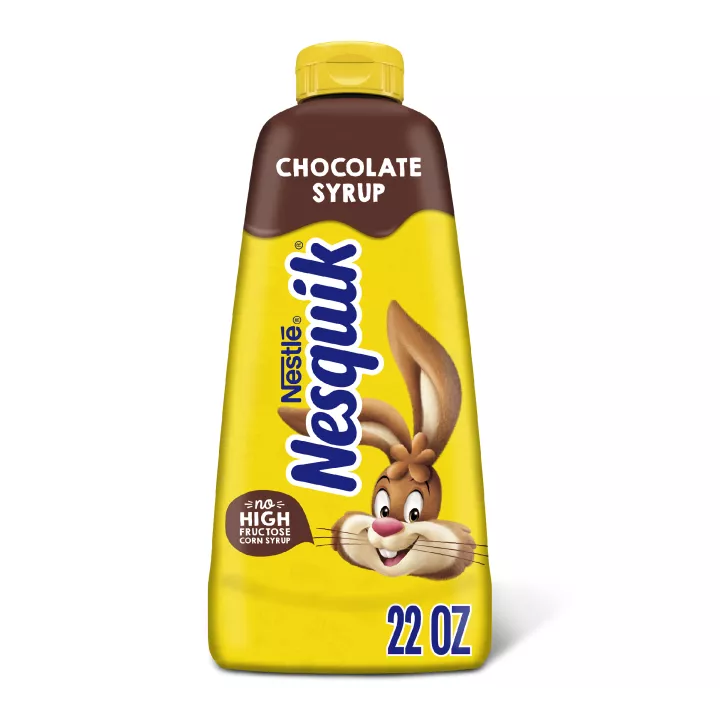 A yellow squeeze bottle with brown labels surrounding the Nesquik bunny.
