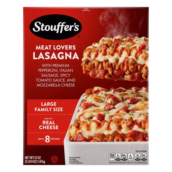 A plate of Meat Lovers Lasagna beside a red dish of lasagna on a table below the product name, and "4 Delicious Meats" label.