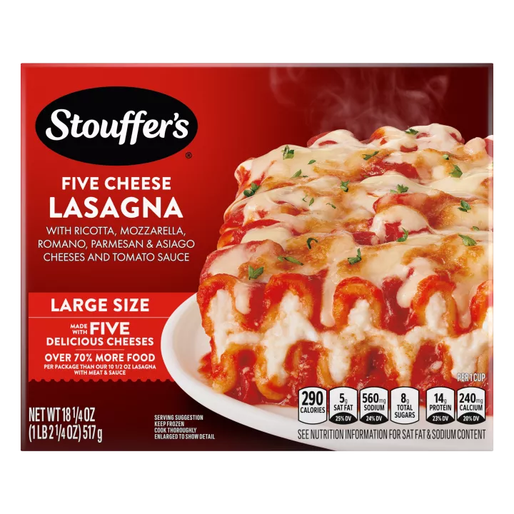 Box of Cheese Lovers Lasagna with a plate of lasagna on a table with the product name and "50% More Cheese" label.