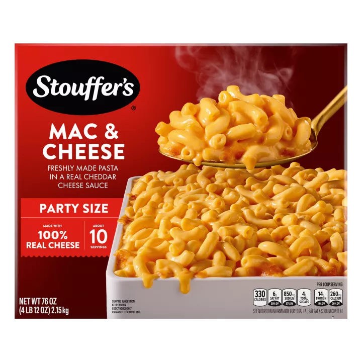 Box of Macaroni & Cheese with a dish of mac & cheese on a table under the product name and "100% REAL CHEESE" label.