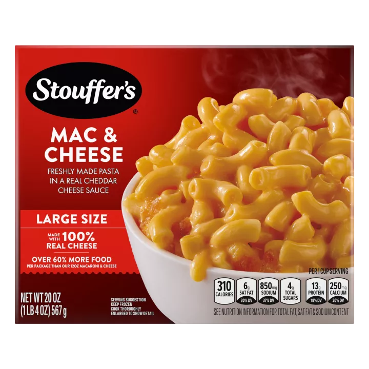 Box of Macaroni & Cheese with a plate of mac & cheese on a table under the product name and "100% REAL CHEESE" label.