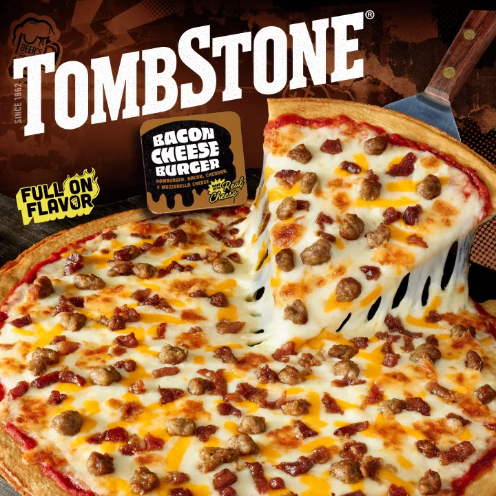 Package of Bacon Cheeseburger pizza with an image of a spatula under a slice of freshly made pizza, with the Tombstone logo and quarter pound of cheese and bold and zest sauce badges.
