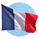 French flag waving in the wind on a blue background.