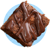 Close up of a brownie slice, on a blue background.