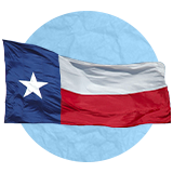 Texan flag waving in the wind on a blue background.