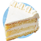 Close up of a slice of vanilla cake with vanilla icing, on a blue background.