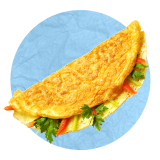 Close up of veggie omelet on a blue background.