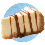 Close up of a slice of cheesecake with chocolate drizzle on a blue background.