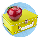 Close up of a lime green metal lunch box with a red delicious apple on it, on a blue background.