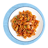 Overhead of a fusilli pasta in tomato sauce on a white plate, on a blue background.
