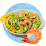 Close up of a seafood salad in a white bowl and a whole cooked shrimp in front of bowl, on a blue background.