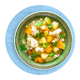 Overhead of a bowl of vegetable soup with lots of diced up veggies, on a blue background.