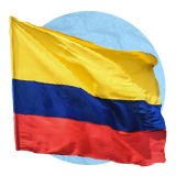 Colombian flag waving in the wind on a blue background.