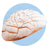 Close up of a pan dulce on a blue background.