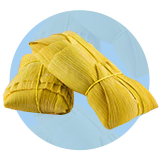 Two tamales stacked on a blue circle.