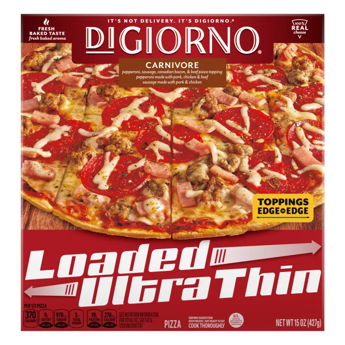 Box of DiGiorno Loaded Ultra Thin Carnivore Pizza on a cutting board & Loaded Ultra Thin logo.