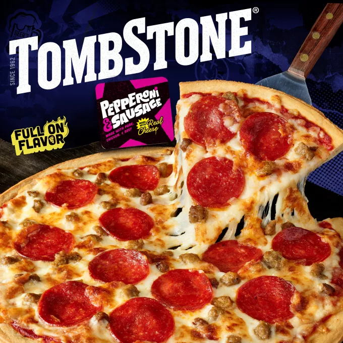 Package of original pepperoni & sausage pizza with a blue label & border, a spatula under a pizza, and the Tombstone logo.