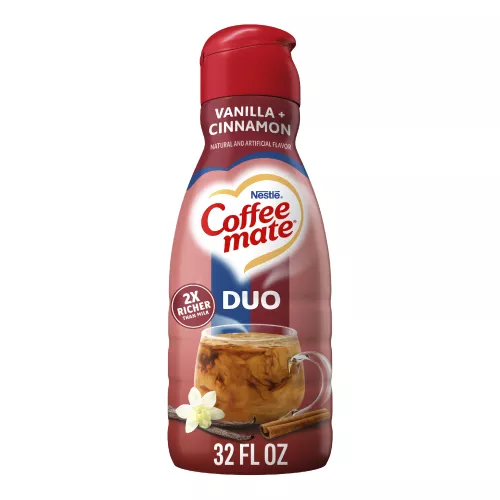A red bottle of Cinnamon Vanilla Crème creamer with a coffee mug and cinnamon sticks under the Coffee mate logo.