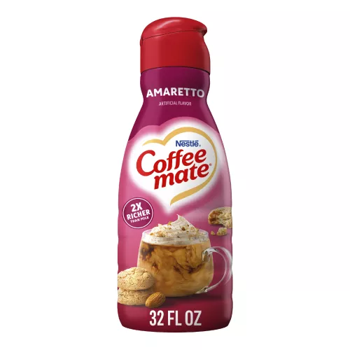 A pink bottle of Amaretto Creamer with amaretto cookies and almonds under the Coffee mate logo.