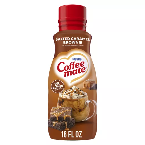 Bottle of Salted Caramel Brownie Coffee Creamer with 2x richer than milk label above a coffee mug, brownies & caramel square.