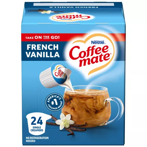 A blue box of single serve Coffee mate Vanilla Creamer with a blue label above coffee mug, vanilla bean and the product logo.