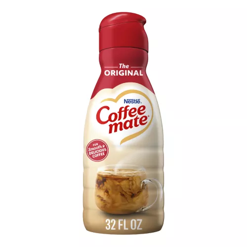 A bottle of Original Creamer with a red label above a coffee mug, biscotti and the product logo.