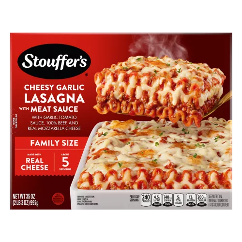 Box of Cheesy Garlic Lasagna with Meat Sauce with a dish and plate of lasagna below the product name and STOUFFER'S logo.