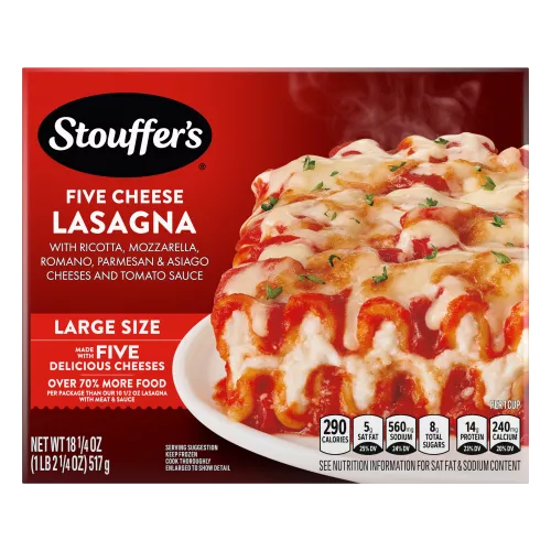 Box of Cheese Lovers Lasagna with a plate of lasagna on a table with the product name and "50% More Cheese" label.