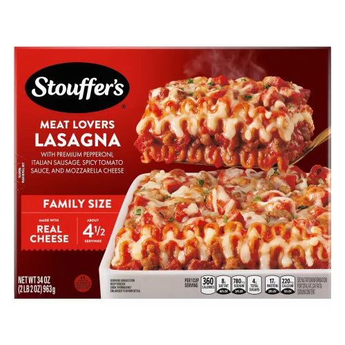 Box of Meat Lovers Lasagna with a plate of lasagna near a dish, the product name, STOUFFER'S logo and "FAMILY SIZE" label.