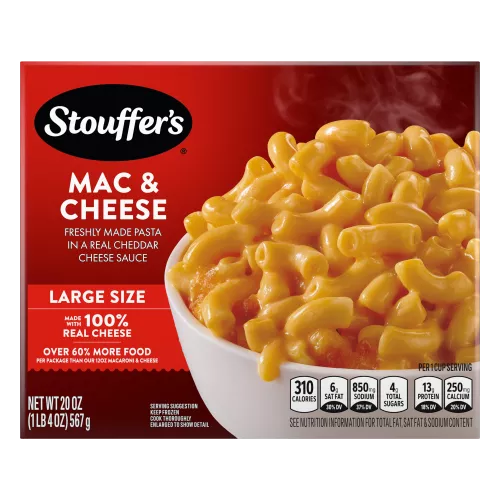 Box of Macaroni & Cheese with a plate of mac & cheese on a table under the product name and "100% REAL CHEESE" label.