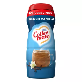 A blue canister of Coffee mate French Vanilla Powder with a red cap above a mug of coffee and vanilla beans.